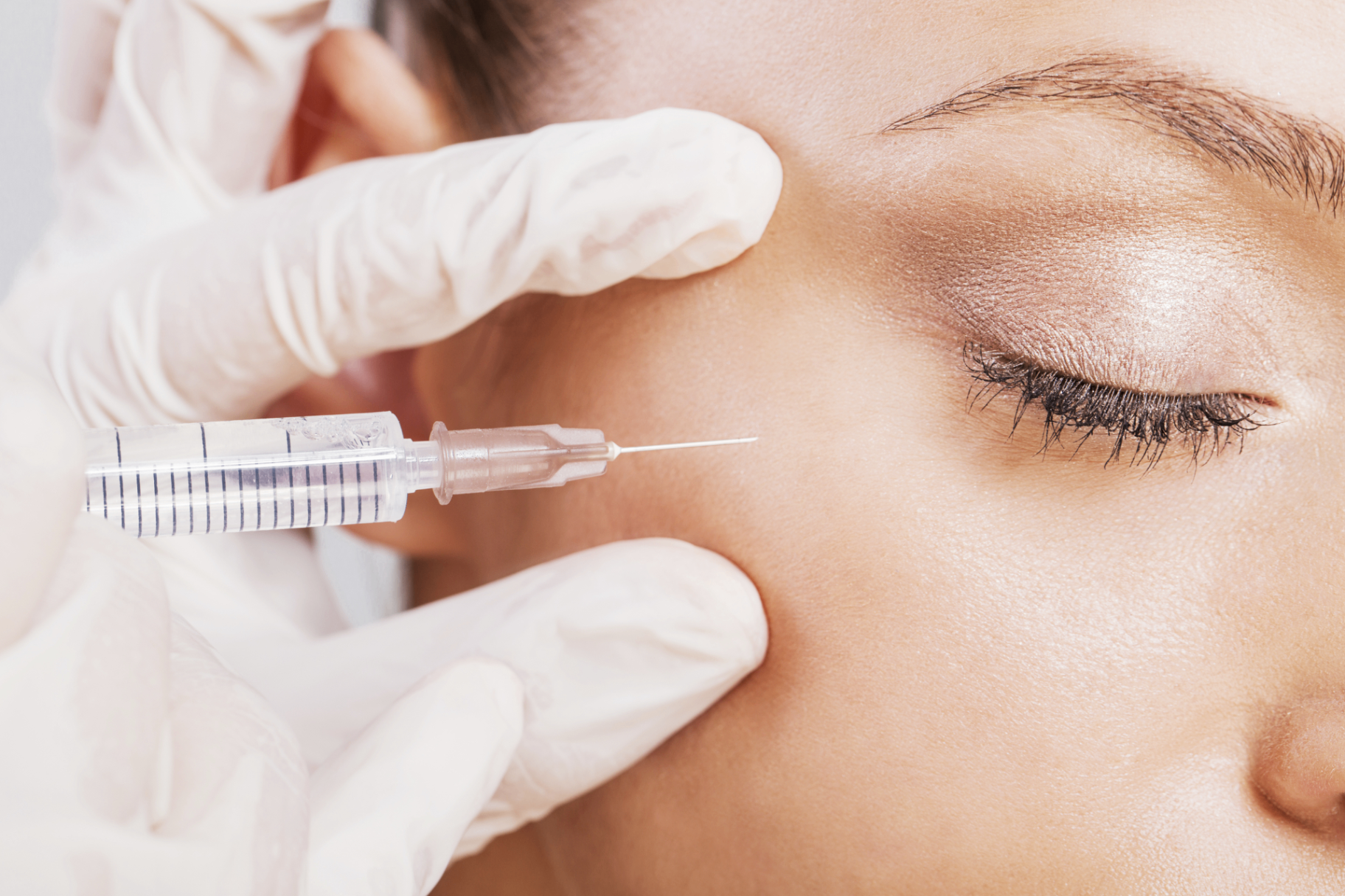 Close-up of a serene face mid-treatment at Zohar