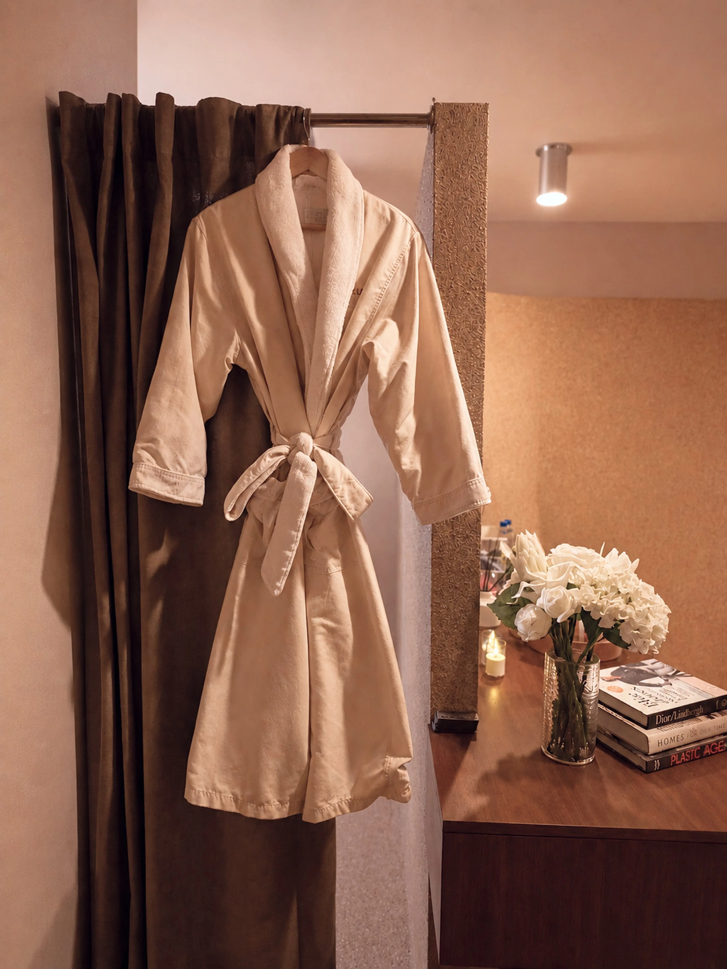 Plush robe and vanity in a private changing area at Zohar