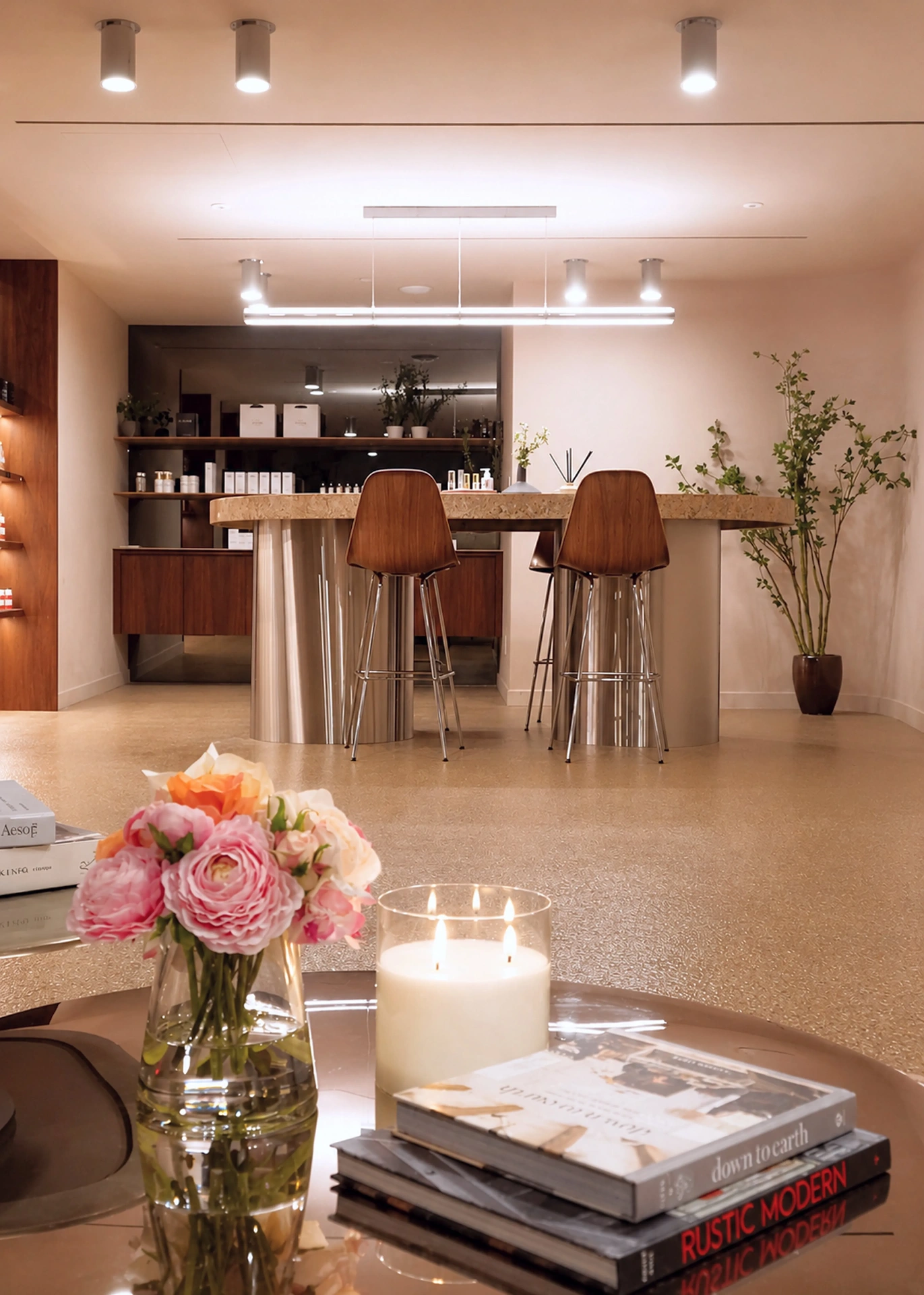 Open boutique floor with consultation bar and bar stools