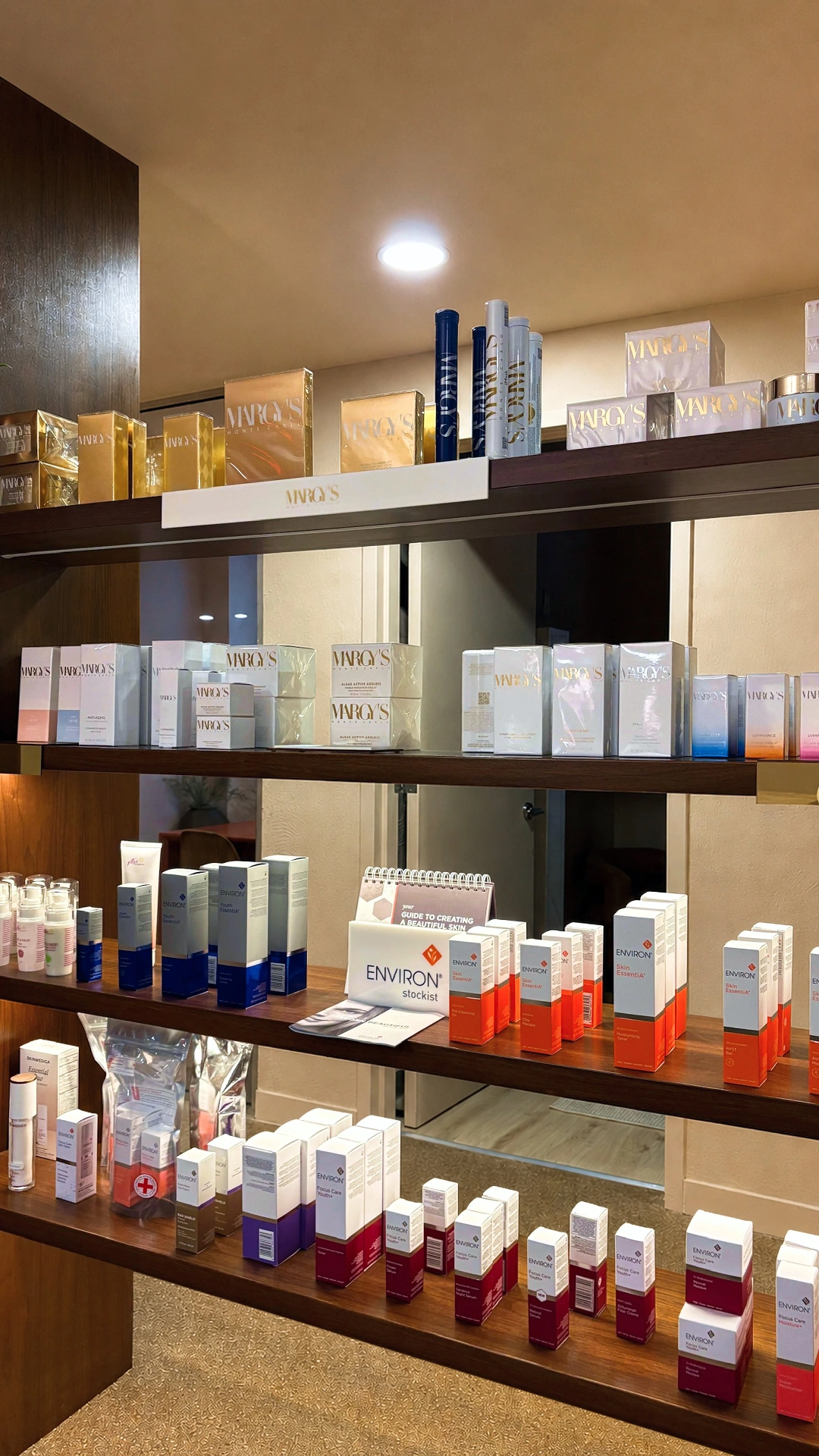 Tiered shelves of Margy's and Environ skincare in the Zohar boutique