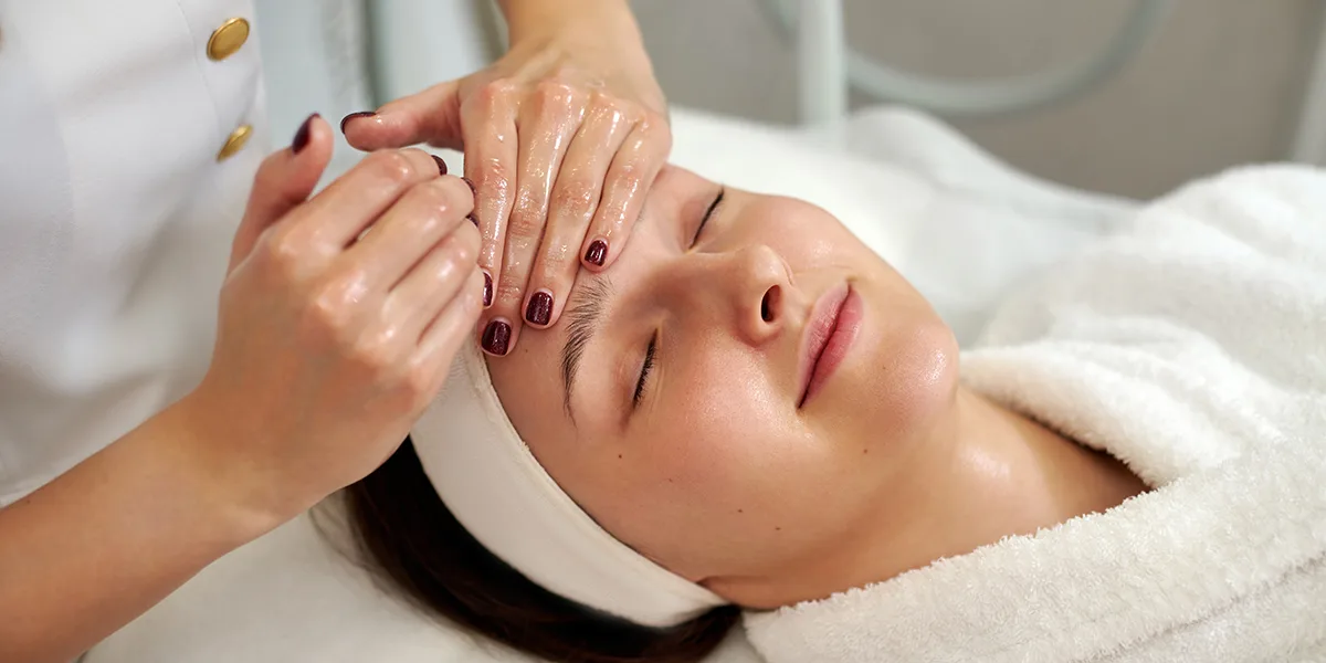 Master esthetician performing a signature facial at Zohar