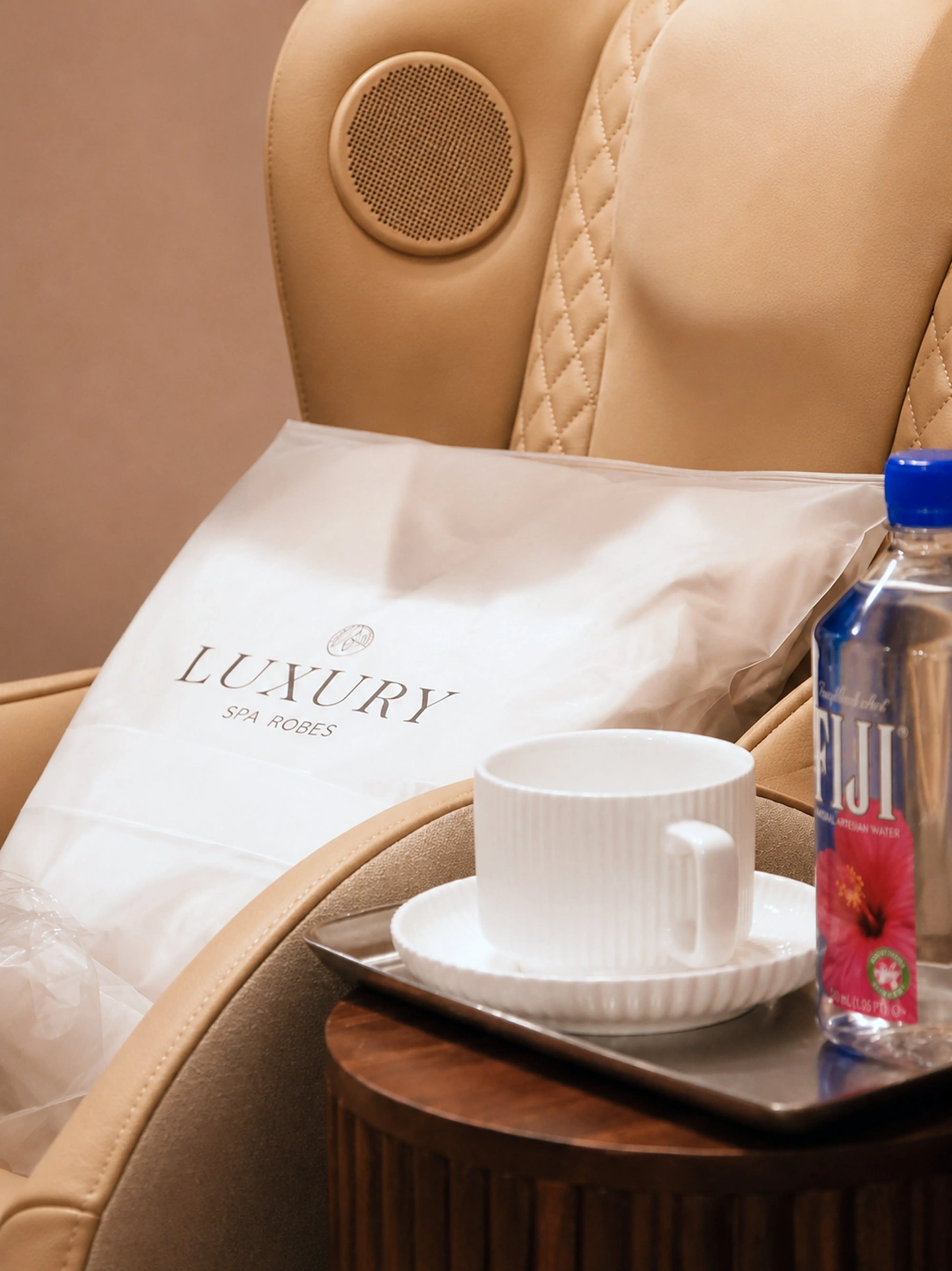 Detail of spa chair with espresso cup and chilled water